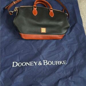 Dooney & Bourke Black and Tan Duffel Bag like new with storage bag
